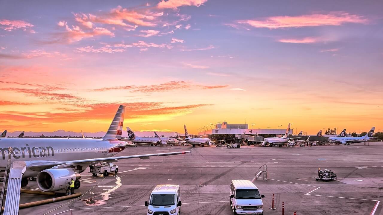 airport and plane under a cloudy sky